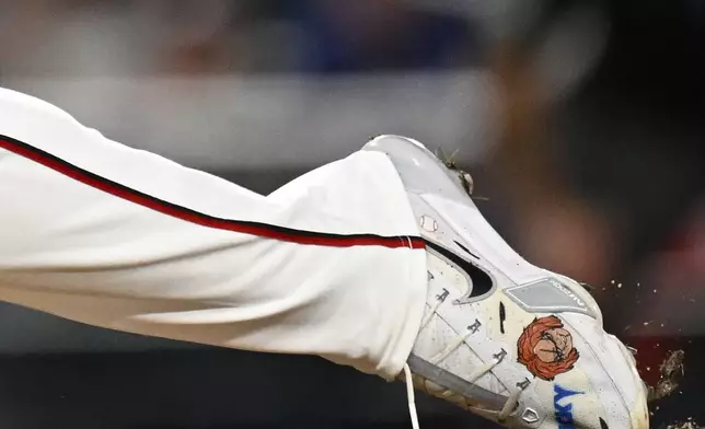 Washington Nationals pitcher Jose A. Ferrer customized shoe is shown as he throws during the seventh inning of a baseball game against the Philadelphia Phillies, Thursday, Aug. 14, 2025, in Washington. (AP Photo/Terrance Williams)