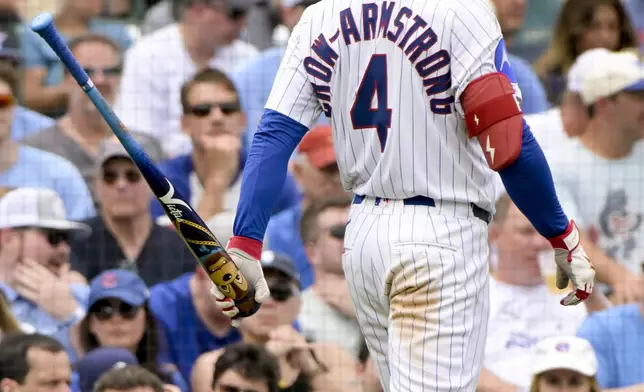 Chicago Cubs' Pete Crow-Armstrong uses a custom bat for Players' Weekend during the fourth inning of a baseball game Pittsburgh Pirates, Sunday, Aug. 17, 2025, at Wrigley Field in Chicago. (AP Photo/Mark Black)