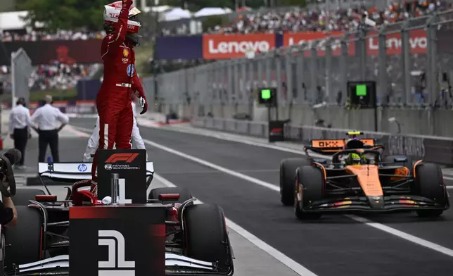 Ferrari driver Charles Leclerc of Monaco celebrates his pole position after the qualifying session for the Hungarian Formula One Grand Prix at the Hungaroring racetrack in Mogyorod, Hungary, Saturday, Aug. 2, 2025. (AP Photo/Denes Erdos)
