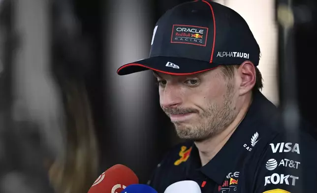 Red Bull driver Max Verstappen of the Netherlands talks to the media after the qualifying session for the Hungarian Formula One Grand Prix at the Hungaroring racetrack in Mogyorod, Hungary, Saturday, Aug. 2, 2025. (AP Photo/Denes Erdos)
