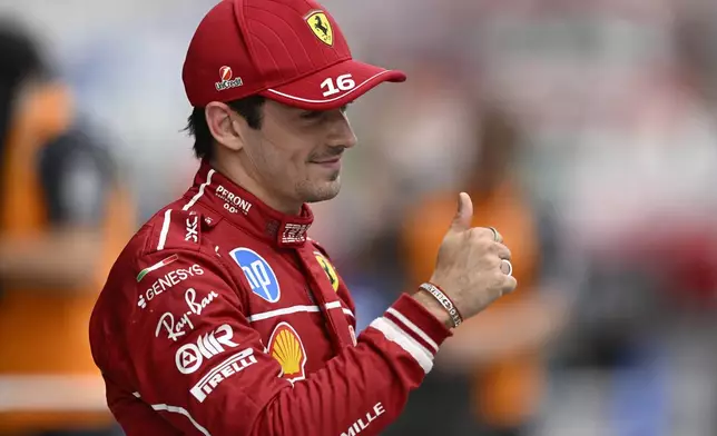 Ferrari driver Charles Leclerc of Monaco celebrates his pole position after the qualifying session for the Hungarian Formula One Grand Prix at the Hungaroring racetrack in Mogyorod, Hungary, Saturday, Aug. 2, 2025. (AP Photo/Denes Erdos)