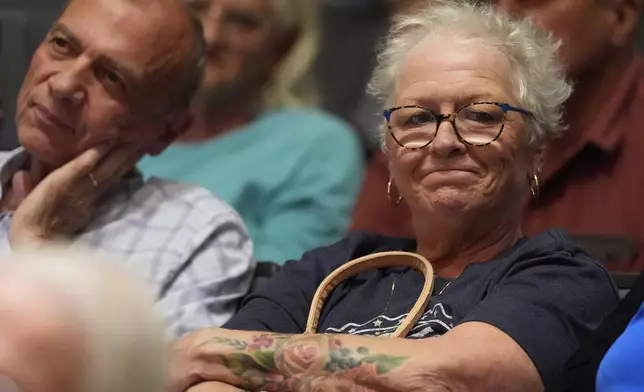 People listen as Republican Rep. Mark Alford addresses attendees at a town hall, Monday, Aug. 25, 2025, in Bolivar, Mo. (AP Photo/Charlie Riedel)
