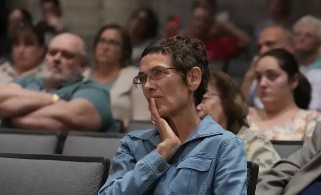 People listen as Republican Rep. Mark Alford addresses attendees at a town hall, Monday, Aug. 25, 2025, in Bolivar, Mo. (AP Photo/Charlie Riedel)