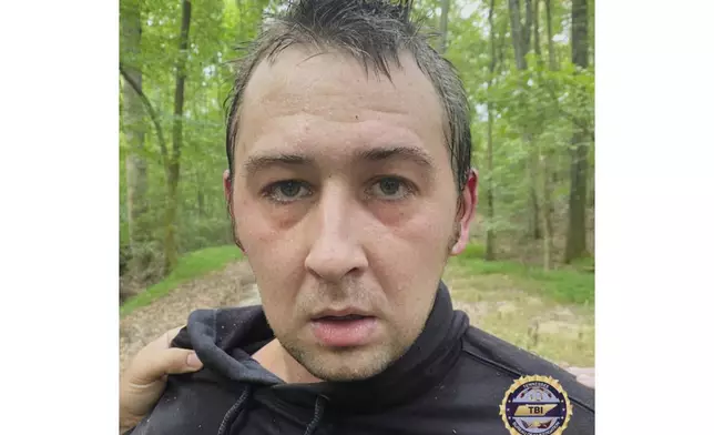 This photo provided by Tennessee Bureau of Investigation on Tuesday, Aug. 5, 2025 shows Austin Drummond, moments after having been taken into custody. (Tennessee Bureau of Investigation via AP)