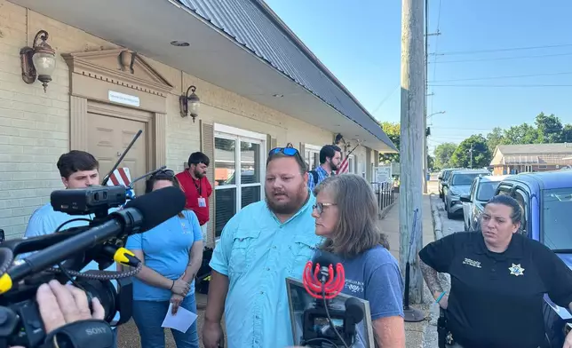 The parents of James M. Wilson, Matthew Wilson, left, and Kim Hamil, speak with reporters after a court hearing for a man charged with killing four people on Thursday, Aug. 7, 2025, in Tiptonville, Tenn. (AP Photo/Adrian Sainz)