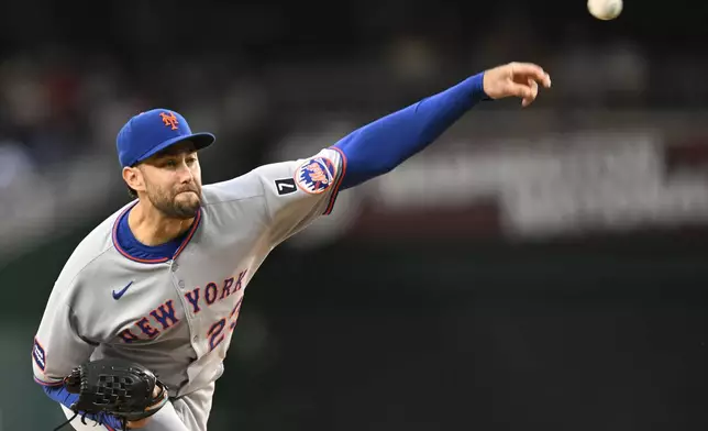 New York Mets starting pitcher David Peterson throws during the second inning of a baseball game against the Washington Nationals Tuesday, Aug. 19, 2025, in Washington. (AP Photo/John McDonnell)