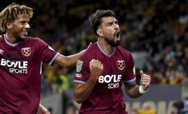 West Ham United's Lucas Paqueta celebrates scoring during the English League Cup second round match between Wolverhampton Wanderers and West Ham United at Molineux Stadium, Wolverhampton, England, Tuesday Aug. 26, 2025. (Mike Egerton/PA via AP)
