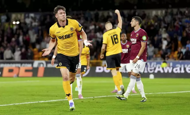 Wolverhampton Wanderers' Jorgen Strand Larsen celebrates scoring during the English League Cup second round match between Wolverhampton Wanderers and West Ham United at Molineux Stadium, Wolverhampton, England, Tuesday Aug. 26, 2025. (David Davies/PA via AP)