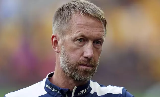 West Ham United manager Graham Potter looks on before a League Cup second round soccer match against the Wolverhampton Wanderers, Tuesday, Aug. 26, 2025, at Molineux Stadium in Wolverhampton, England. (Mike Egerton/PA via AP)