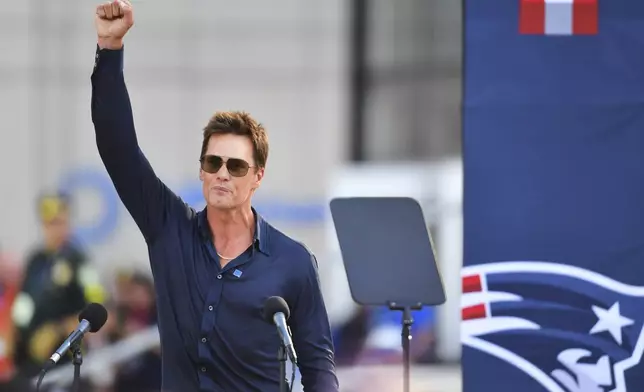 Former New England Patriots quarterback Tom Brady speaks after a bronze statue of himself was unveiled in Patriot Place Plaza before an NFL preseason football game between the Washington Commanders and the New England Patriots Friday, Aug. 8, 2025, in Foxborough, Mass. (AP Photo/Charles Krupa)