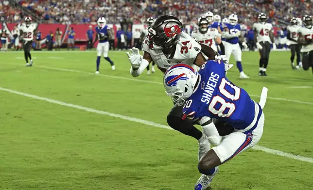 Buffalo Bills wide receiver Tyrell Shavers scores past Tampa Bay Buccaneers cornerback Bryce Hall during the first half of an NFL preseason football game, Saturday, Aug. 23, 2025, in Tampa, Fla. (AP Photo/Jason Behnken)