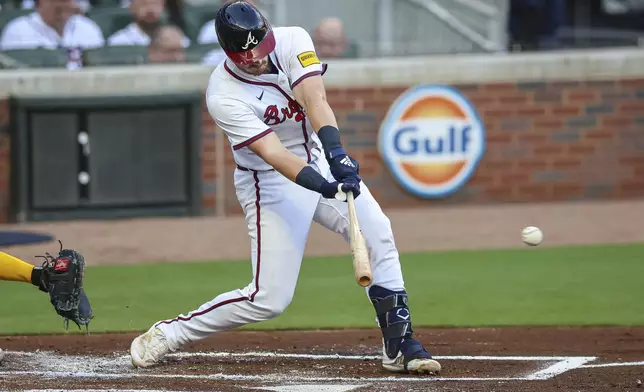 Atlanta Braves' Sean Murphy hits an RBI single in the first inning of a baseball game against the Milwaukee Brewers, Wednesday, Aug. 6, 2025, in Atlanta. (AP Photo/Colin Hubbard)
