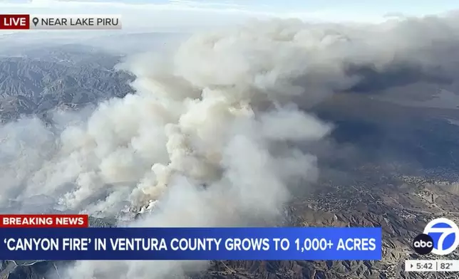 This image taken from video by ABC7 Los Angeles shows smoke rising from the Canyon Fire on Thursday, Aug. 7, 2025, near Lake Piru, Calif. (ABC7 Los Angeles via AP)