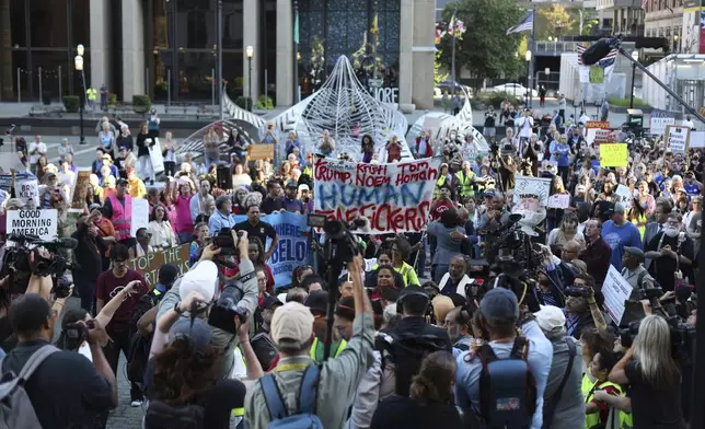 People attend a protest rally at the Immigration and Customs Enforcement field office in Baltimore, Monday, Aug. 25, 2025, to support Kilmar Abrego Garcia. (AP Photo/KT Kanazawich)