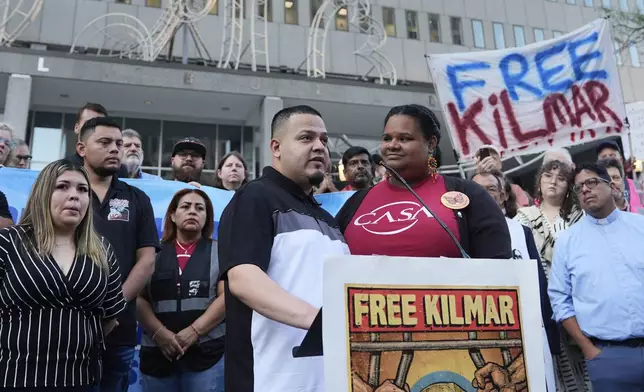 Jennifer Vasquez Sura, front left, wife of Kilmar Abrego Garcia, attends a protest rally at the Immigration and Customs Enforcement field office in Baltimore, Monday, Aug. 25, 2025, to support Kilmar Abrego Garciab. (AP Photo/Stephanie Scarbrough)