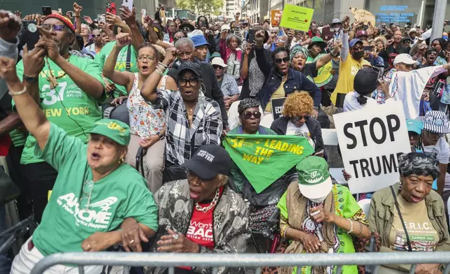 Protesters cheer as they listen to speeches for the March on Wall Street, Thursday, Aug. 28, 2025, in New York. (AP Photo/Heather Khalifa)