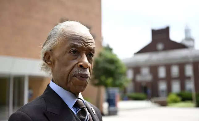 Rev. Al Sharpton speaks with reporters after delivering a sermon at Howard University's Cramton Auditorium, Sunday, Aug. 24, 2025, in Washington, to announce a national drive in support of District of Columbia Mayor Muriel Bowser, as President Donald Trump's administration continues it's use of federal law enforcement and National Guard troops in the city. (AP Photo/John McDonnell)