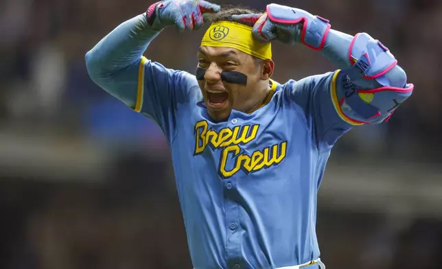Milwaukee Brewers' William Contreras reacts after his winning home run during the ninth inning of a baseball game against the San Francisco Giants, Friday, Aug. 22, 2025, in Milwaukee. (AP Photo/Jeffrey Phelps)
