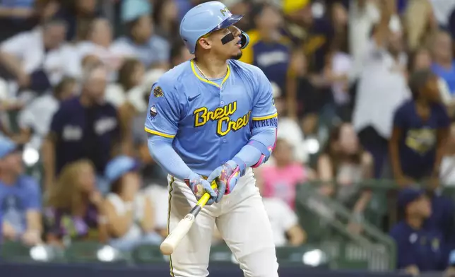 Milwaukee Brewers' William Contreras watches his winning home run during the ninth inning of a baseball game against the San Francisco Giants, Friday, Aug. 22, 2025, in Milwaukee. (AP Photo/Jeffrey Phelps)