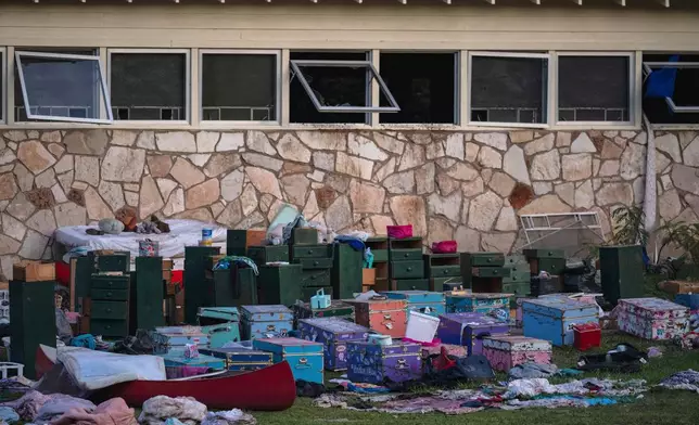 FILE - The belongings of campers sit outside one of Camp Mystic's cabins near the Guadalupe River in Hunt, Texas, on July 7, 2025, after a deadly flash flood swept through the area. (AP Photo/Eli Hartman, File)
