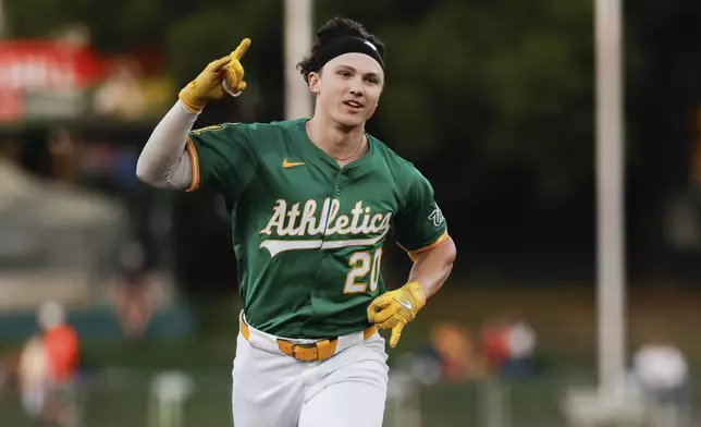 Athletics' Zack Gelof rounds the bases after hitting a two-run home run during the second inning of a baseball game against the Detroit Tigers, Wednesday, Aug. 27, 2025, in West Sacramento, Calif. (AP Photo/Sergio Estrada)