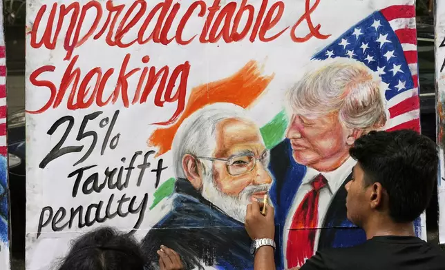 A student of Gurukul school of Art completes artwork of U.S. President Donald Trump and Prime Minister of India Narendra Modi, in Mumbai, India, Friday, Aug. 1, 2025. (AP Photo/Rajanish Kakade)