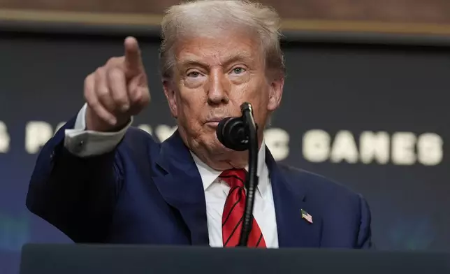 President Donald Trump answers questions from reporters after signing an executive order about the 2028 Los Angeles Olympic Games, in the South Court Auditorium of the Eisenhower Executive Office Building on the White House campus, Tuesday, Aug. 5, 2025, in Washington. (AP Photo/Alex Brandon)