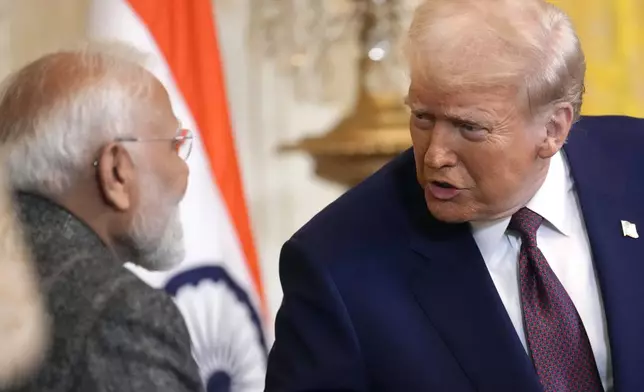 FILE - President Donald Trump, right, speaks with India's Prime Minister Narendra Modi during a news conference in the East Room of the White House, Feb. 13, 2025, in Washington. (AP Photo/Ben Curtis, File)
