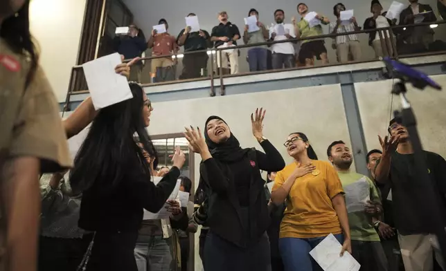 Participants sing during a gathering of "Nyanyi Bareng Jakarta" or "Singing Together Jakarta" community in Jakarta, Indonesia, Saturday, July 19, 2025. (AP Photo/Dita Alangkara)