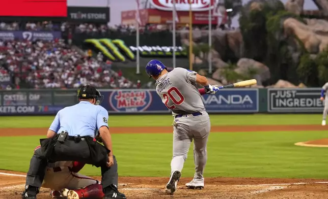 Chicago Cubs' Reese McGuire hits a grand slam during the fourth inning of a baseball game against the Los Angeles Angels, Saturday, Aug. 23, 2025, in Anaheim, Calif. (AP Photo/Mark J. Terrill)