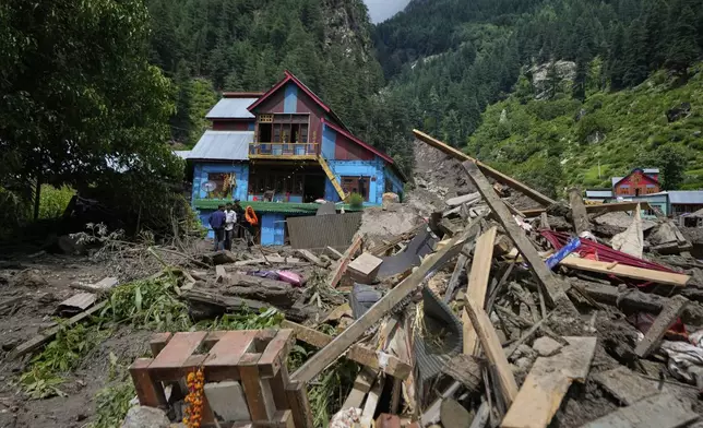 Buildings damaged by Thursday's flash floods are seen in Chositi village, Kishtwar district, Indian-controlled Kashmir, Friday, Aug. 15, 2025. (AP Photo/Channi Anand)