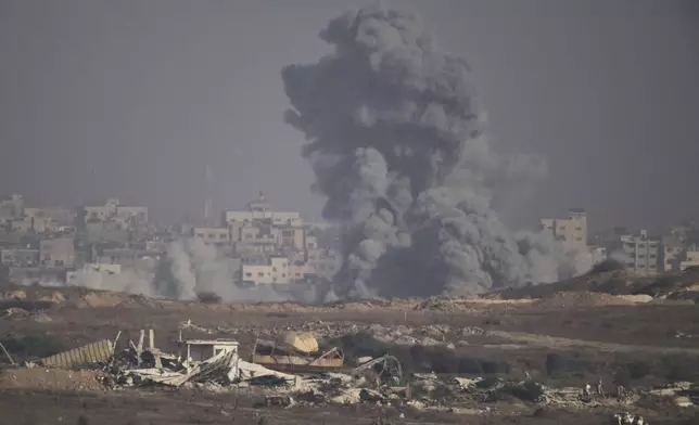 Smoke rises to the sky following an Israeli airstrike in the northern Gaza Strip as seen from southern Israel, Monday, Aug. 25, 2025. (AP Photo/Leo Correa)