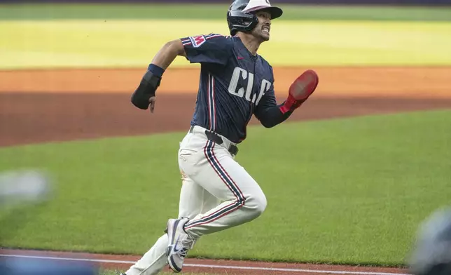 Cleveland Guardians' Steven Kwan heads for home plate on a single by Jose Ramirez during the first inning of a baseball game against the Minnesota Twins, Friday, Aug. 1, 2025, in Cleveland. (AP Photo/Phil Long)