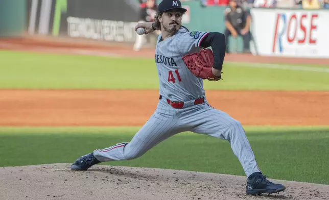 Minnesota Twins starting pitcher Joe Ryan delivers against the Cleveland Guardians during the first inning of a baseball game, Friday, Aug. 1, 2025, in Cleveland. (AP Photo/Phil Long)