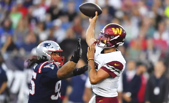 New England Patriots defensive tackle Khyiris Tonga (95) threatens Washington Commanders quarterback Sam Hartman (15) during the first half of an NFL preseason football game Friday, Aug. 8, 2025, in Foxborough, Mass. (AP Photo/Steven Senne)