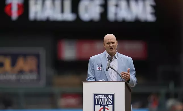 Former Minnesota Twins player Corey Koskie speaks during a ceremony after being inducted into the team's Hall of Fame before a baseball game against the Detroit Tigers, Sunday, Aug. 17, 2025, in Minneapolis. (AP Photo/Abbie Parr)