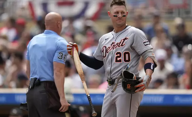 Detroit Tigers' Spencer Torkelson (20) stands at the plate after striking out to end the top of the first inning of a baseball game against the Minnesota Twins, Sunday, Aug. 17, 2025, in Minneapolis. (AP Photo/Abbie Parr)