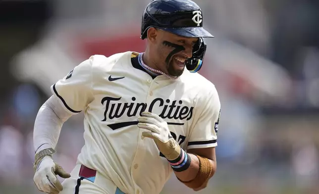 Minnesota Twins' Royce Lewis runs the bases after hitting a solo home run during the second inning of a baseball game against the Detroit Tigers, Sunday, Aug. 17, 2025, in Minneapolis. (AP Photo/Abbie Parr)