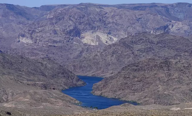 FILE - The Colorado River cuts through Black Canyon, June 6, 2023, near White Hills, Ariz. (AP Photo/Matt York, File)