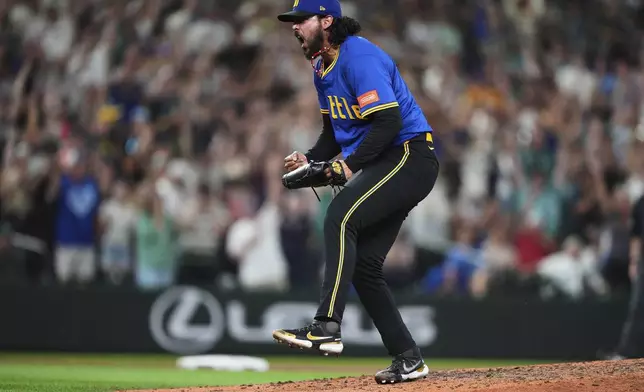 Seattle Mariners relief pitcher Andrés Muñoz reacts to earning the save in a win over the Athletics in a baseball game Friday, Aug. 22, 2025, in Seattle. (AP Photo/Lindsey Wasson)