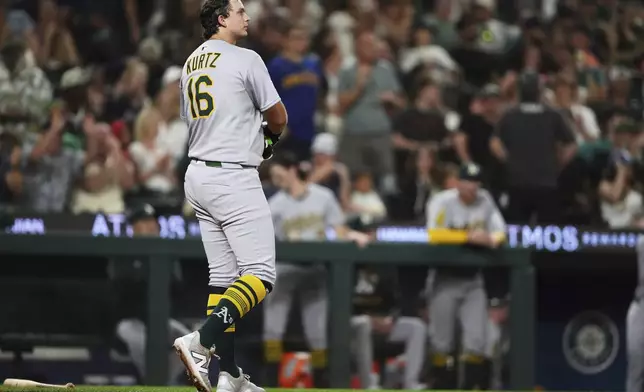 Athletics' Nick Kurtz (16) reacts to striking out to end the top of the eighth inning of a baseball game against the Seattle Mariners, Friday, Aug. 22, 2025, in Seattle. (AP Photo/Lindsey Wasson)