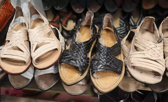Sandals known as "huaraches" are displayed for sale at a market in Oaxaca, Mexico, Friday, Aug. 8, 2025. (AP Photo/Luis Alberto Cruz)