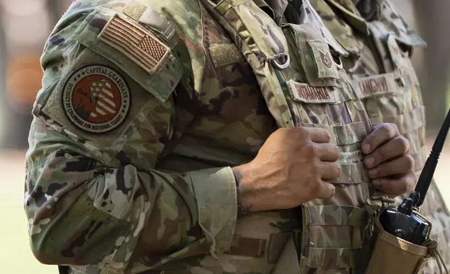 Members of the District of Columbia National Guard patrol along the National Mall, Saturday, Aug. 16, 2025, in Washington. (AP Photo/Julia Demaree Nikhinson)