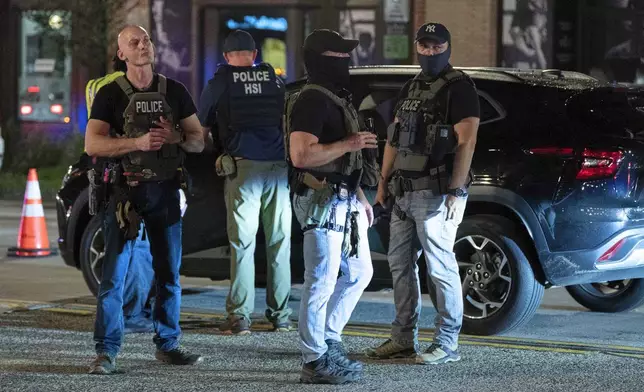Department of Homeland Security Investigations agents join Washington Metropolitan Police Department officers as they conduct traffic checks at a checkpoint along 14th Street in northwest Washington, Wednesday, Aug. 13, 2025, in Washington. (AP Photo/Jose Luis Magana)