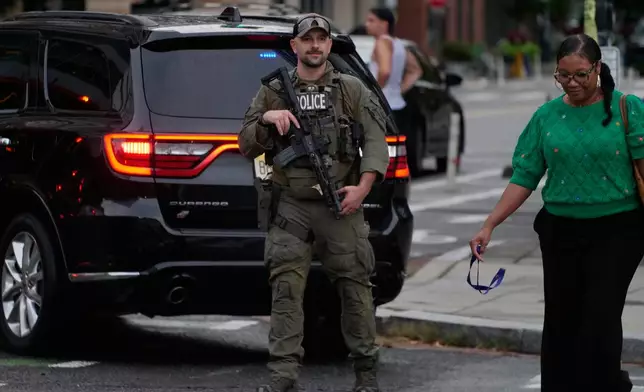 U.S. Drug Enforcement Administration agents join Washington Metropolitan Police Department officers on patrol in the Navy Yard neighborhood of Washington, Wednesday, Aug. 13, 2025. (AP Photo/Anthony Peltier)