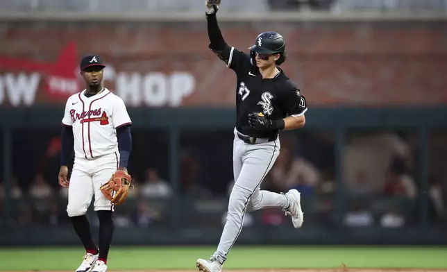 Chicago White Sox' Brooks Baldwin rounds the bases after hitting a home run in the third inning of a baseball game against the Atlanta Braves, Monday, Aug. 18, 2025, in Atlanta. (AP Photo/Colin Hubbard)