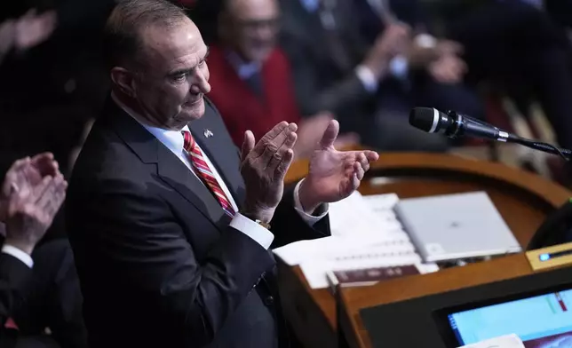 FILE - Missouri Gov. Mike Kehoe applauds while delivering the State of the State address, Jan. 28, 2025, in Jefferson City, Mo. (AP Photo/Jeff Roberson, File)