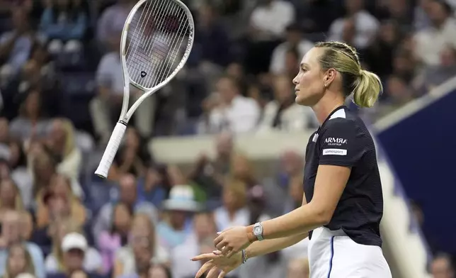 Donna Vekic, of Croatia, flips her racquet after losing a point to Coco Gauff, of the United States, during the second round of the U.S. Open tennis championships, Thursday, Aug. 28, 2025, in New York. (AP Photo/Frank Franklin II)