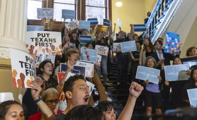 Supporters for the returning Texas democrats chant as members enter the house at the Texas Capitol in Austin, Texas, Monday, Aug. 18, 2025. (AP Photo/Stephen Spillman)