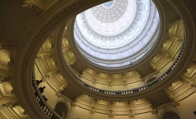 Texas state troopers post outside of the House Chamber where Democratic Texas state Rep. Nicole Collier refuses to leave due to a required law enforcement escort, Tuesday, Aug. 19, 2025, in Austin, Texas. (AP Photo/Eric Gay)